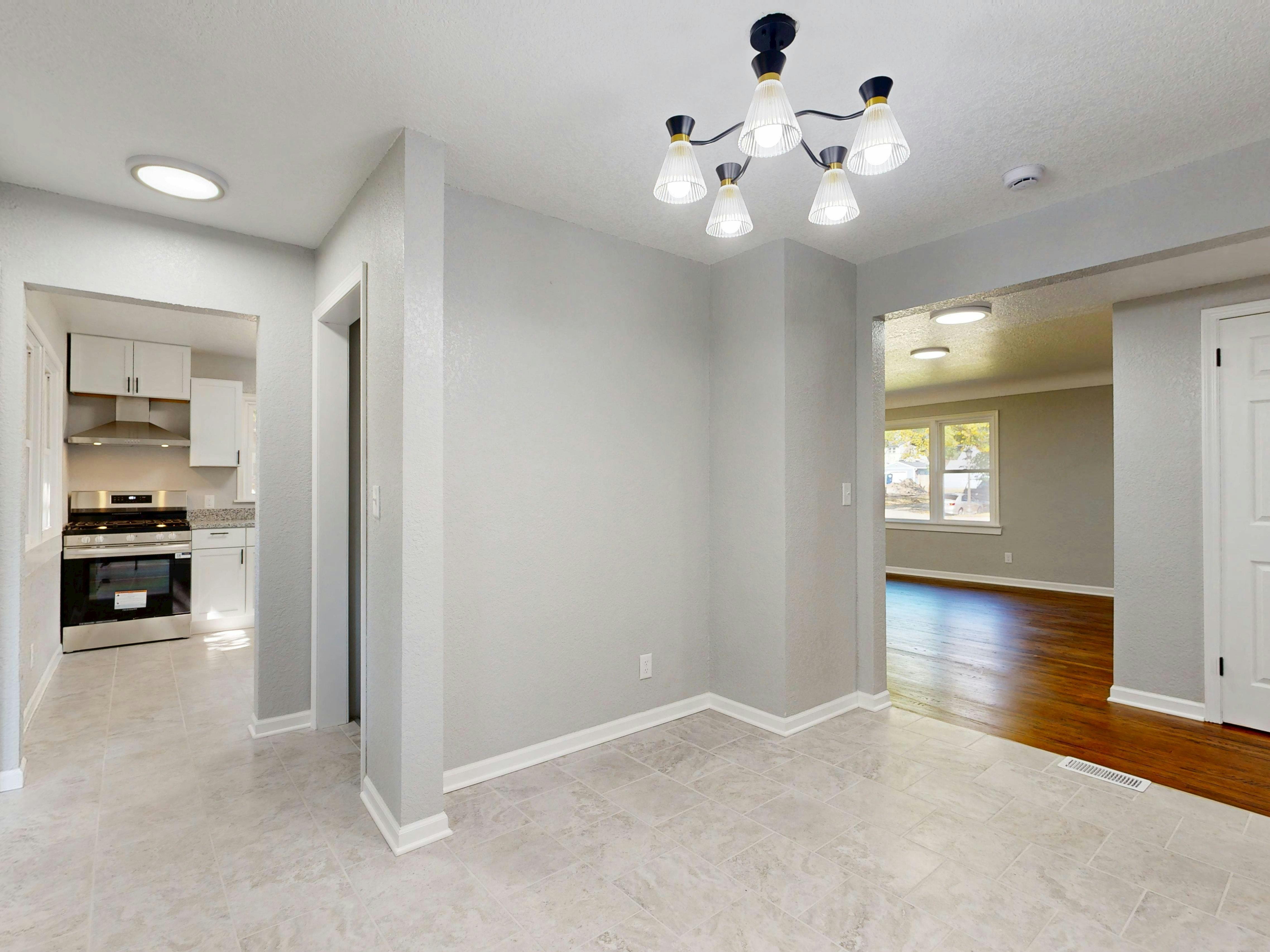Freshly prepared interior with updated lighting, paint, and flooring ready for rental