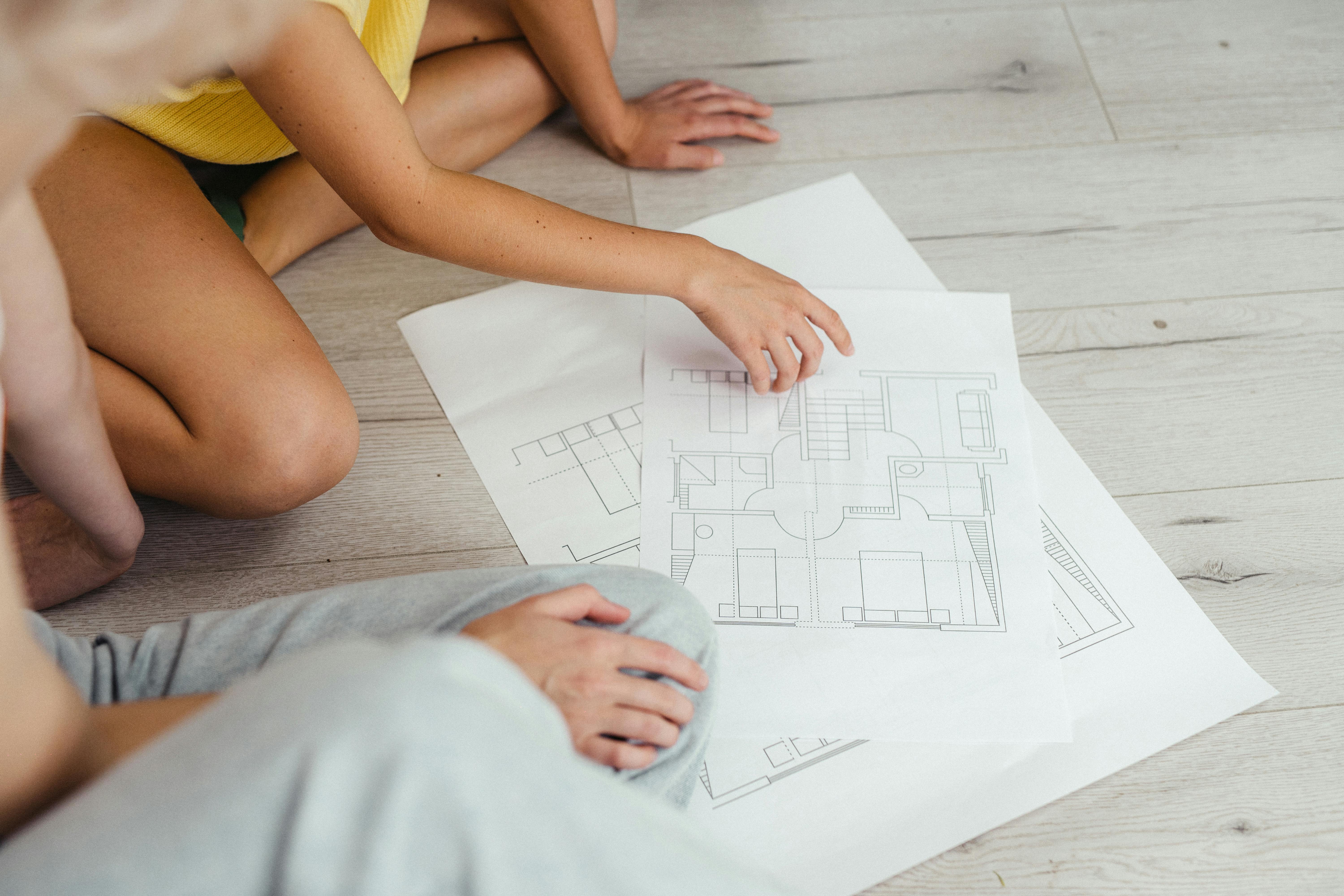 People reviewing a floor plan together as part of rental preparation planning